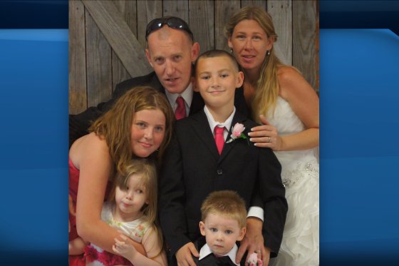 A photo of a family at a wedding.